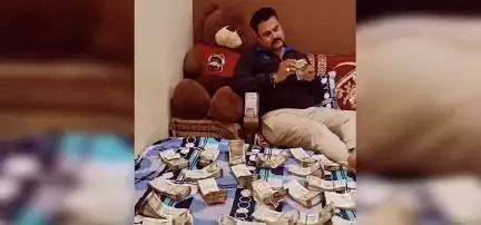 उज्जैन में बिस्तर पर नोटों की गड्डियां बिछाकर होमगार्ड के जवान ने बनाई रील, वायरल होने के बाद जांच शुरू #होमगार्ड